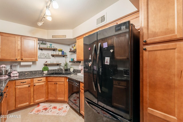 8787 E Mountain View Rd Unit 1110, Scottsdale, AZ 85258 - kitchen with black appliances, open shelves, light tile patterned flooring, dark stone countertops, and brown cabinetry
