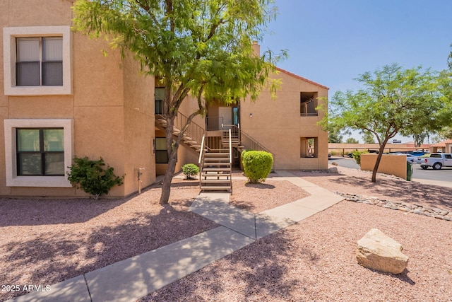 8787 E Mountain View Rd Unit 1110, Scottsdale, AZ 85258 - view of building exterior featuring stairs