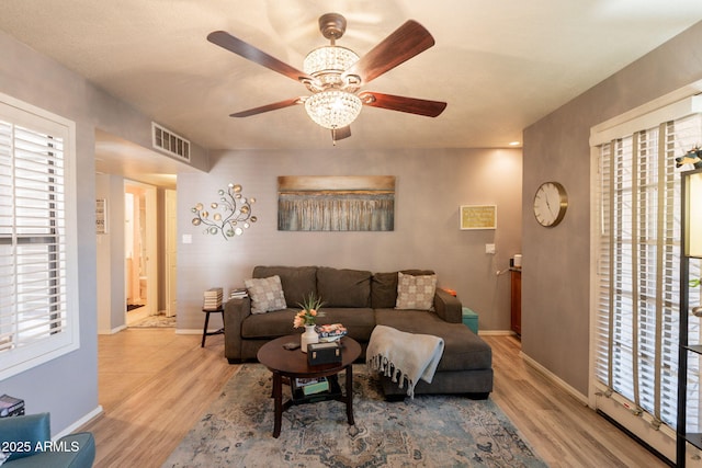 8787 E Mountain View Rd Unit 1110, Scottsdale, AZ 85258 - living room featuring plenty of natural light, wood finished floors, and ceiling fan