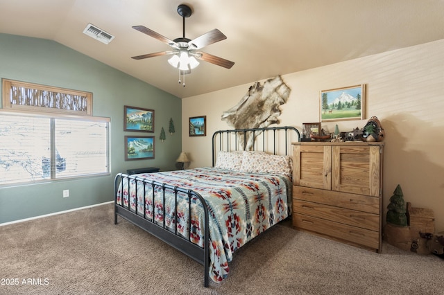 carpeted bedroom with ceiling fan and lofted ceiling