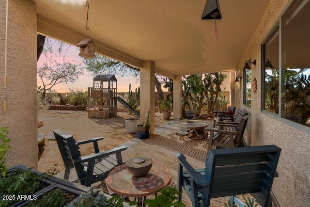 patio terrace at dusk with a playground