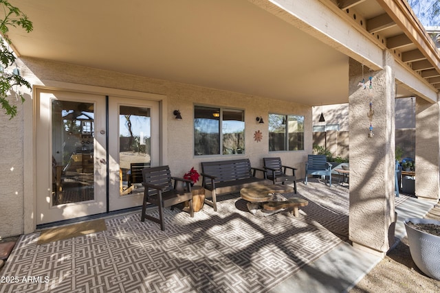 view of patio featuring outdoor lounge area and french doors