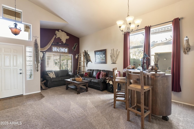 living room with carpet, lofted ceiling, a chandelier, and a healthy amount of sunlight