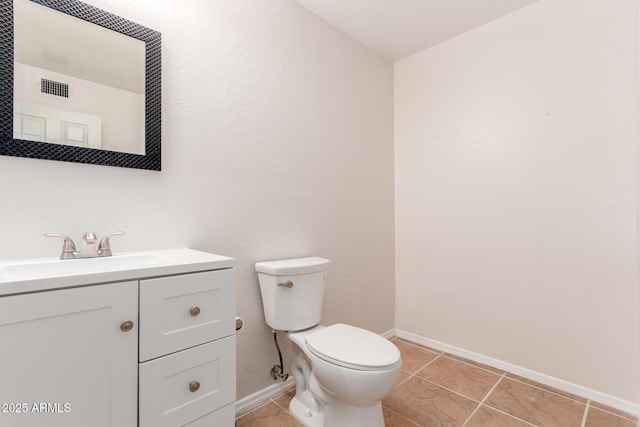 bathroom featuring baseboards, visible vents, toilet, tile patterned flooring, and vanity