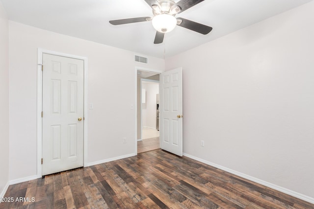 unfurnished bedroom with baseboards, visible vents, ceiling fan, and wood finished floors