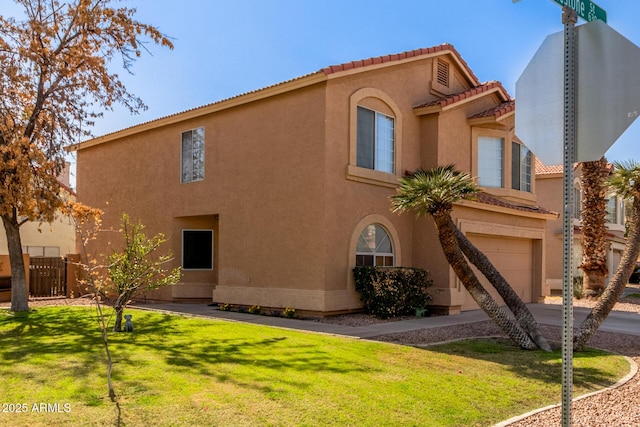 exterior space featuring an attached garage, fence, and concrete driveway