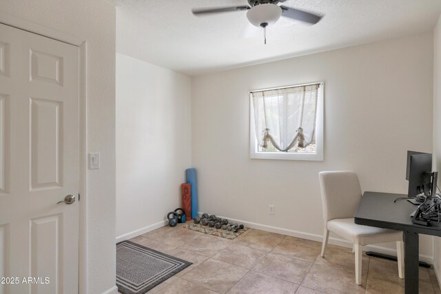 office with light tile patterned floors, baseboards, and a ceiling fan