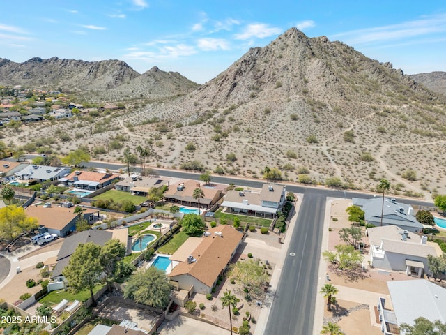 birds eye view of property featuring a mountain view and a residential view