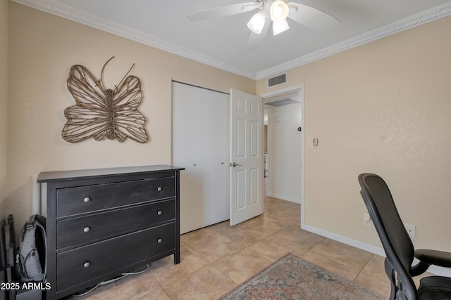 office area with crown molding, visible vents, a ceiling fan, and light tile patterned floors