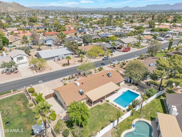 birds eye view of property featuring a mountain view and a residential view