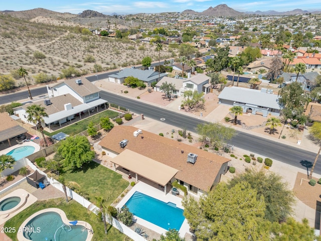 birds eye view of property with a residential view and a mountain view