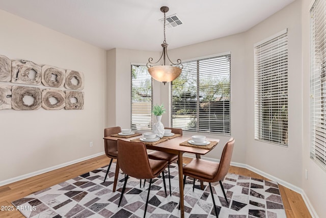 dining space featuring hardwood / wood-style flooring