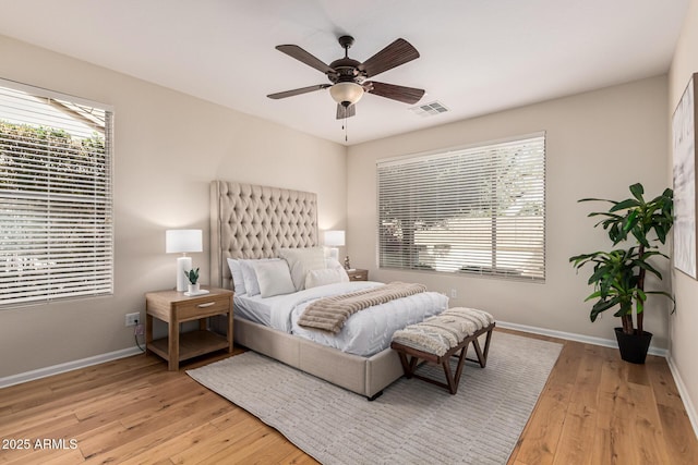 bedroom with light wood-type flooring and ceiling fan