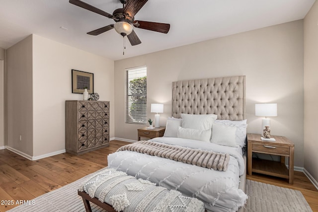 bedroom with ceiling fan and light hardwood / wood-style floors