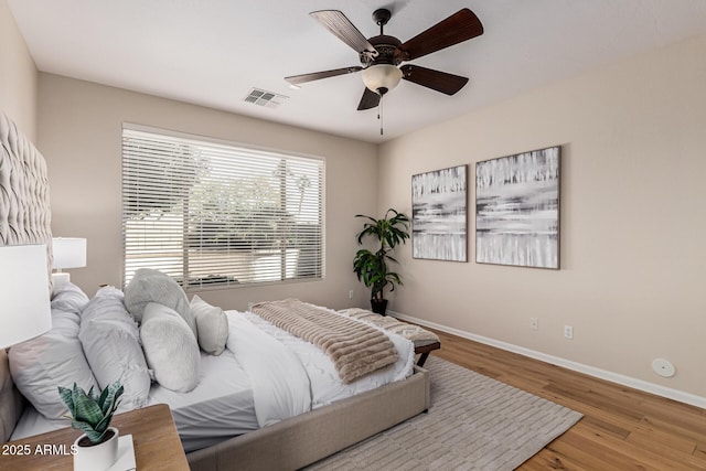 bedroom featuring ceiling fan and light hardwood / wood-style flooring