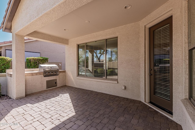 view of patio with area for grilling