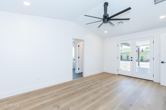 empty room featuring lofted ceiling, french doors, ceiling fan, light wood finished floors, and recessed lighting