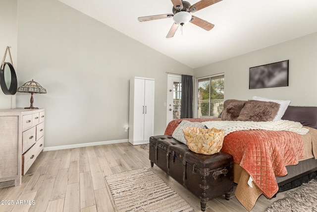 bedroom featuring vaulted ceiling, ceiling fan, and light wood-type flooring