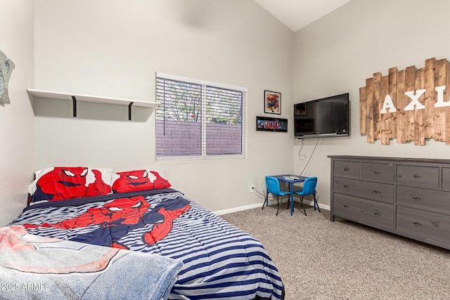 bedroom featuring carpet flooring and vaulted ceiling