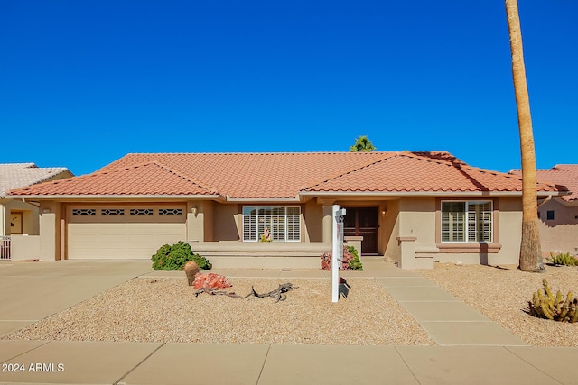 view of front of property with a garage