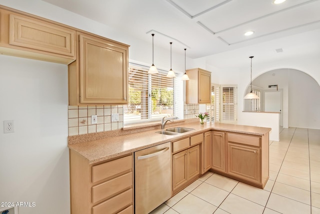 kitchen featuring dishwasher, sink, tasteful backsplash, decorative light fixtures, and light tile patterned flooring