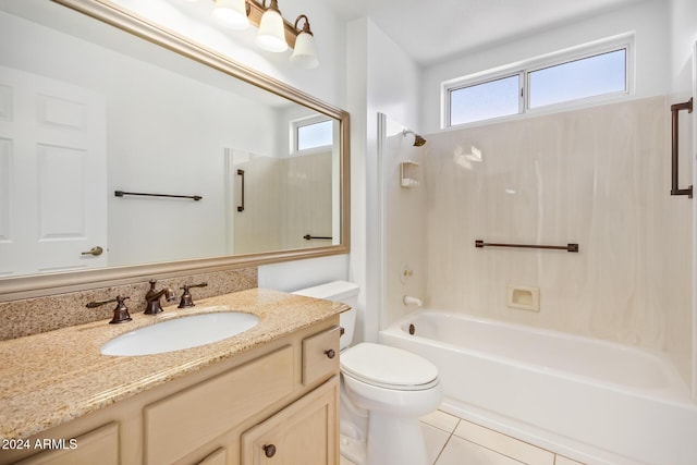 full bathroom featuring tile patterned floors, toilet, vanity, and tub / shower combination