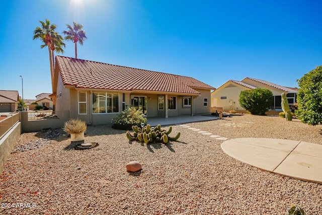 rear view of house with a patio