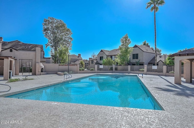 view of swimming pool with a patio area