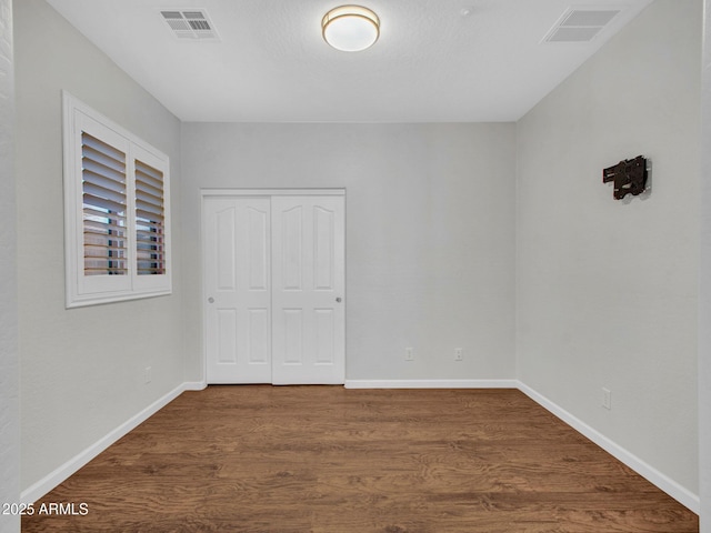 empty room featuring dark hardwood / wood-style floors