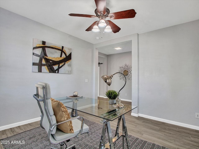 office area with hardwood / wood-style floors and ceiling fan