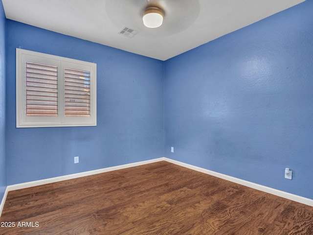 unfurnished room featuring hardwood / wood-style flooring