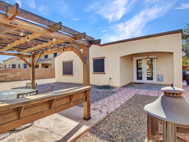 view of patio / terrace with a pergola and french doors