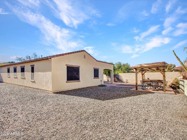 rear view of house featuring a patio