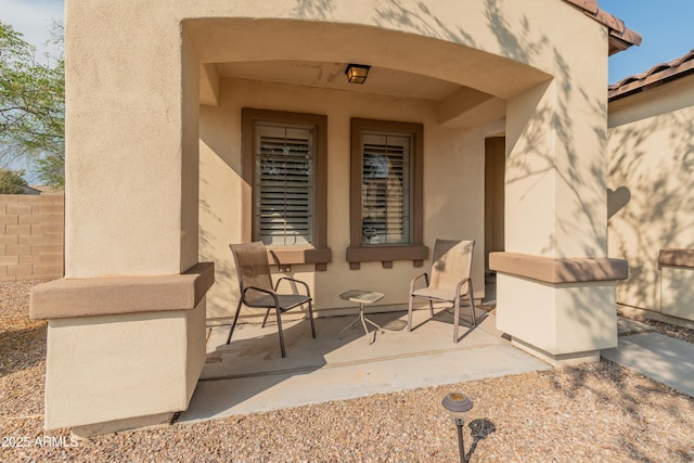 property entrance featuring a patio