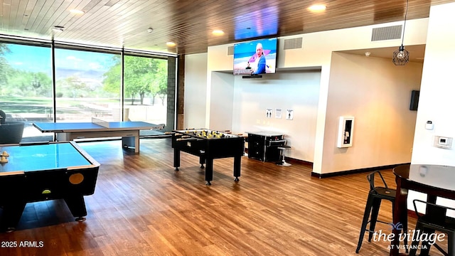 game room featuring expansive windows, hardwood / wood-style flooring, and wood ceiling