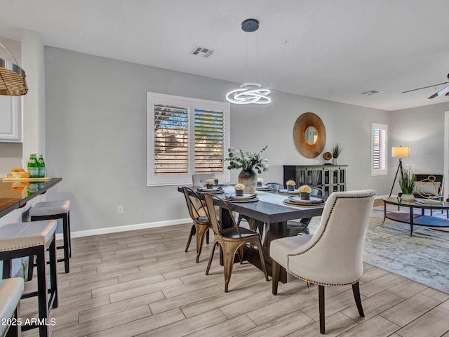 dining space with ceiling fan