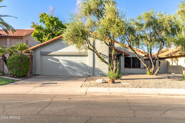 2114 S El Marino, Mesa, AZ 85202 - view of front of home featuring concrete driveway, stucco siding, a tiled roof, and a garage