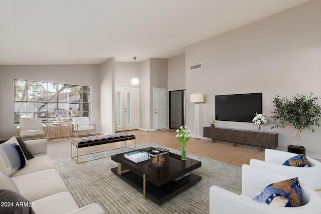 2114 S El Marino, Mesa, AZ 85202 - living room featuring high vaulted ceiling, visible vents, baseboards, and wood finished floors