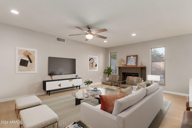 2114 S El Marino, Mesa, AZ 85202 - living area with light wood-style floors, ceiling fan, a fireplace, visible vents, and recessed lighting