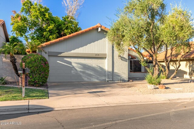 2114 S El Marino, Mesa, AZ 85202 - view of front facade with concrete driveway, a tile roof, an attached garage, and stucco siding