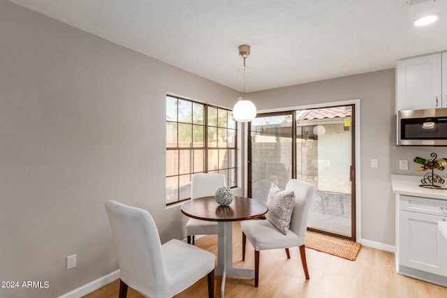 dining area with light hardwood / wood-style flooring