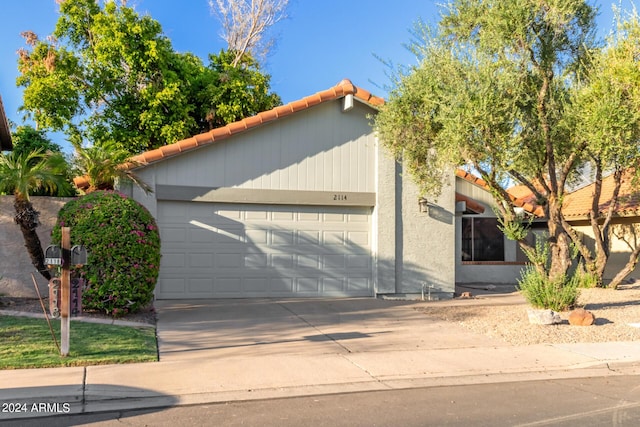 2114 S El Marino, Mesa, AZ 85202 - view of front facade with a tiled roof, a garage, stucco siding, and concrete driveway