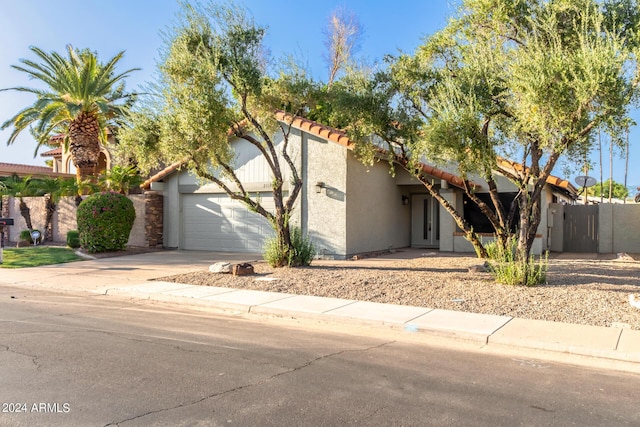 2114 S El Marino, Mesa, AZ 85202 - view of front of house with stucco siding, driveway, an attached garage, a tile roof, and fence