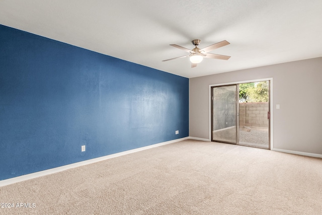 empty room featuring carpet floors and ceiling fan