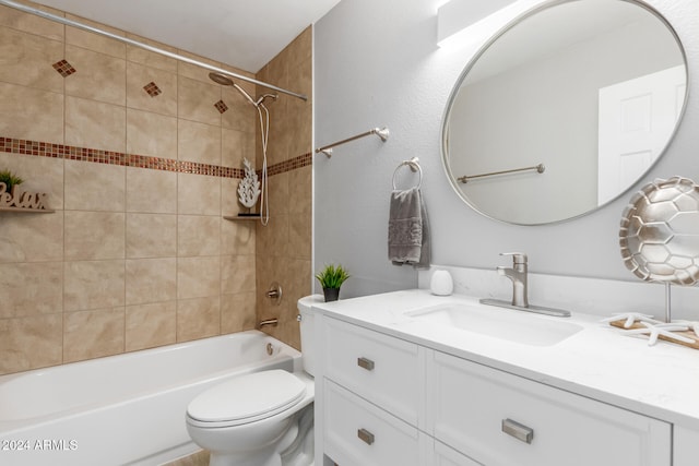 full bathroom featuring toilet, tiled shower / bath combo, and vanity