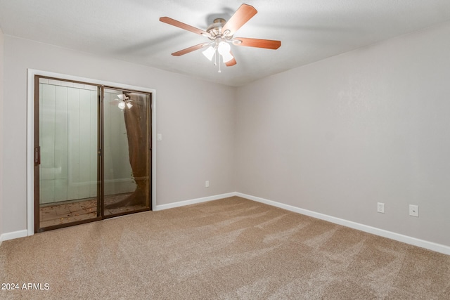 empty room featuring carpet and ceiling fan