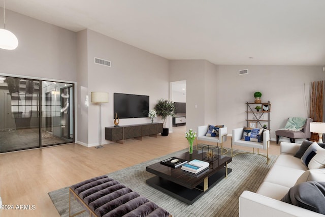 2114 S El Marino, Mesa, AZ 85202 - living area with wood finished floors, baseboards, vaulted ceiling, and visible vents