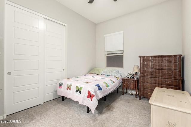 bedroom with carpet flooring, ceiling fan, and a closet