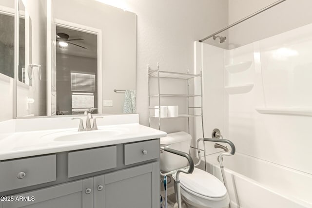 full bathroom with vanity, bathtub / shower combination, and toilet