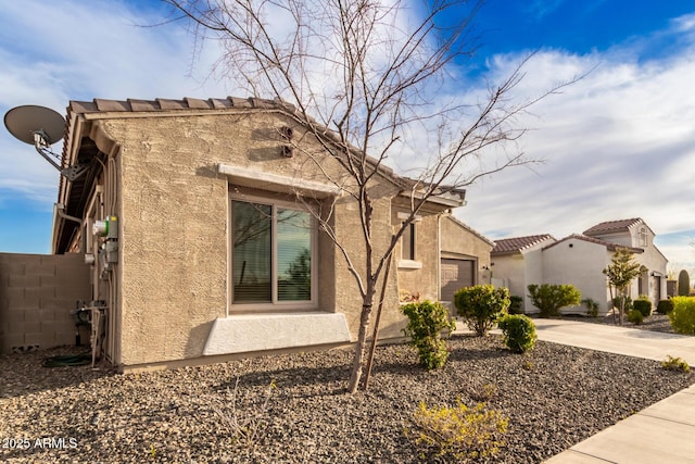 view of home's exterior featuring a garage